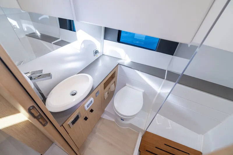 Slide: The Image of Modern bathroom interior of 2023 Fjord 41 XL yacht, featuring sleek design and compact amenities. - 46