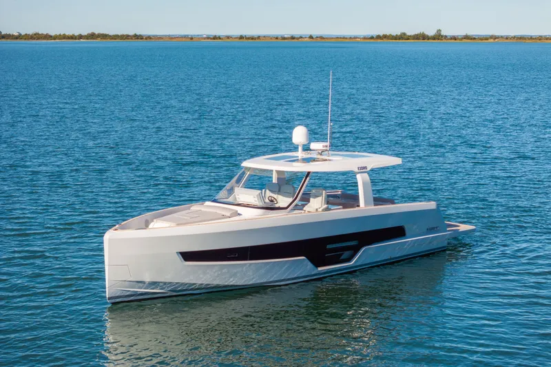 Slide: The Image of 2023 Fjord 41 XL yacht cruising on calm blue waters. - 2