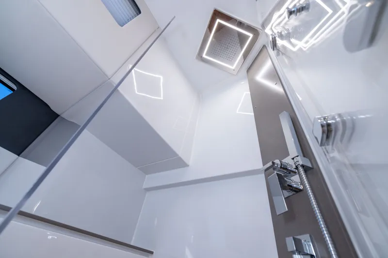 Slide: The Image of Modern shower interior in 2023 Fjord 41 XL yacht, featuring sleek design and chrome fixtures. - 49