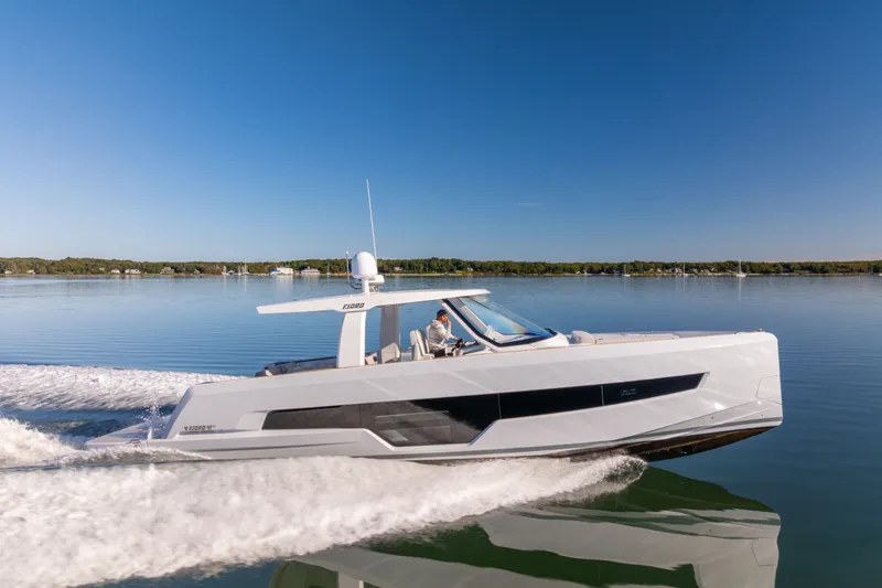 The Image of 2023 Fjord 41 XL yacht cruising on calm waters under a clear blue sky. - 0