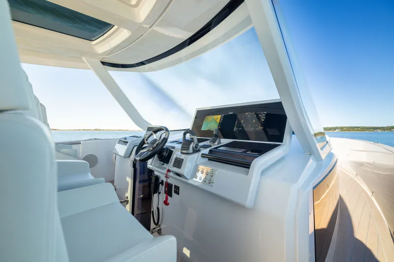 Slide: The Image of Modern helm of 2023 Fjord 41 XL yacht with advanced navigation systems. - 33
