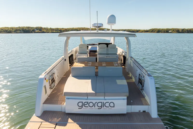 Slide: The Image of 2023 Fjord 41 XL yacht on serene water, featuring spacious deck and modern design. - 7