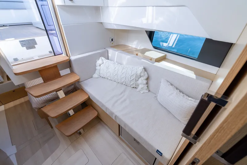 Slide: The Image of Interior of 2023 Fjord 41 XL yacht with cozy seating and wooden steps. - 52