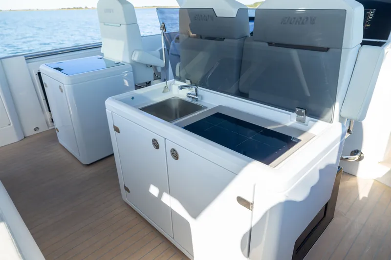 Slide: The Image of Outdoor kitchen on 2023 Fjord 41 XL yacht with sink and stove, overlooking water. - 29