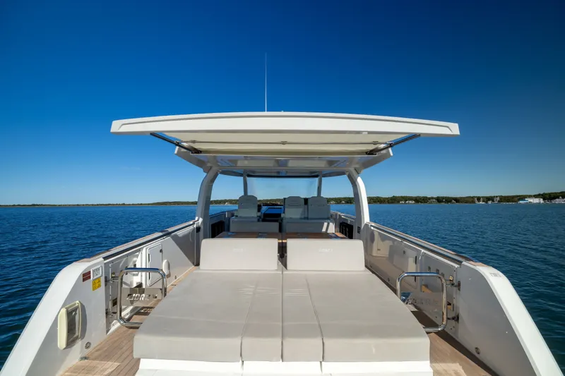 Slide: The Image of 2023 Fjord 41 XL yacht with spacious deck, cruising on calm blue waters. - 12