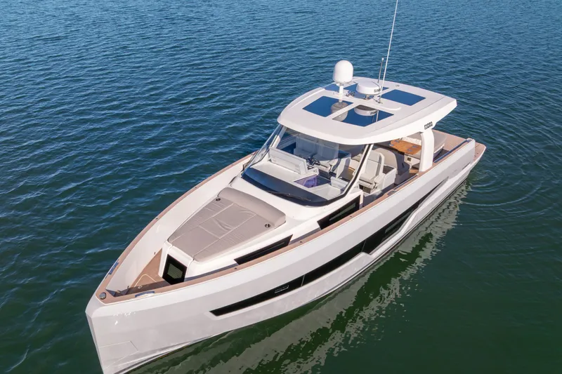Slide: The Image of 2023 Fjord 41 XL luxury yacht cruising on calm blue waters. - 10