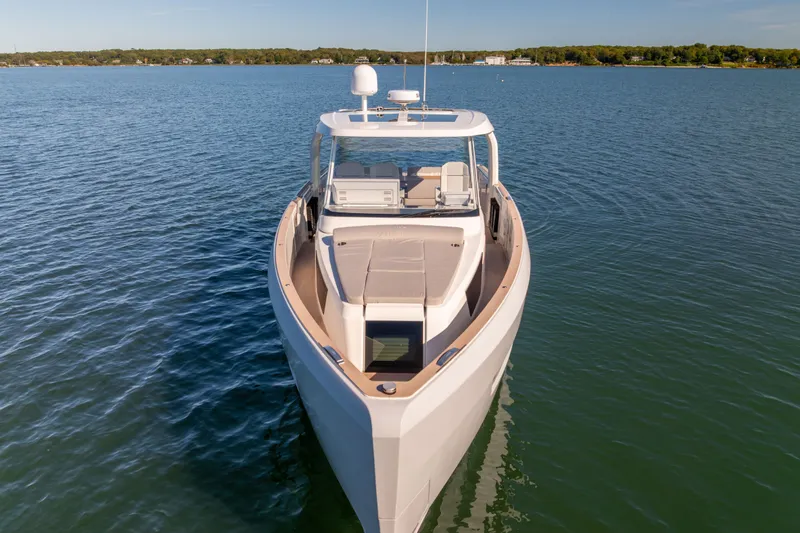 Slide: The Image of 2023 Fjord 41 XL yacht on calm water, showcasing sleek design and luxury features. - 9
