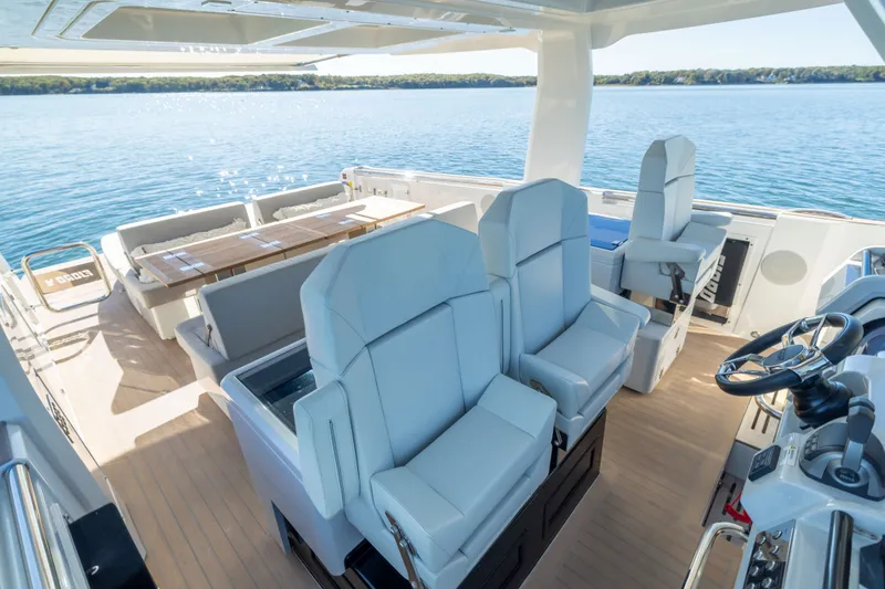 Slide: The Image of 2023 Fjord 41 XL yacht interior with luxurious seating and scenic ocean view. - 40