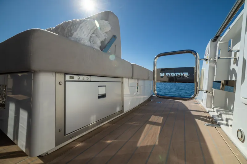 Slide: The Image of Luxurious 2023 Fjord 41 XL yacht deck with seating and ocean view. - 21