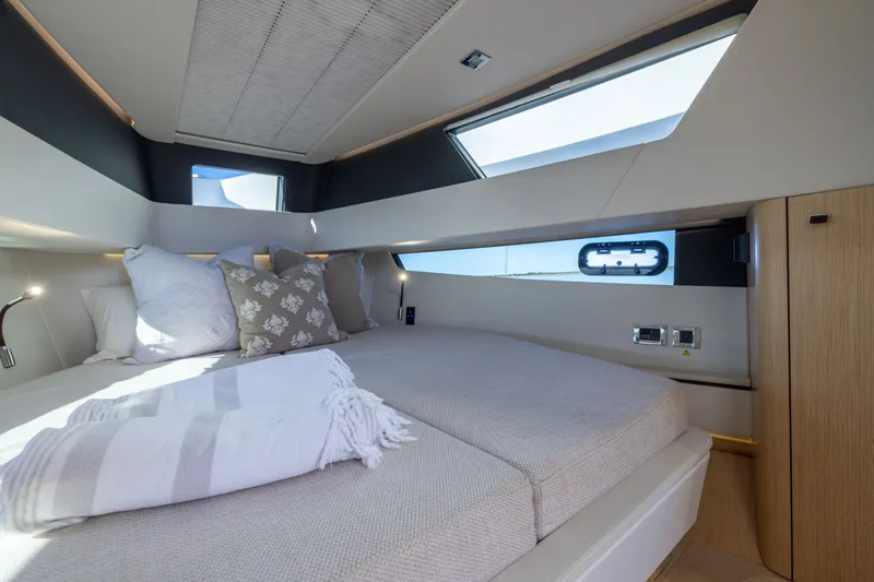 Slide: The Image of Luxurious cabin interior of 2023 Fjord 41 XL yacht with modern bedding and natural light. - 55