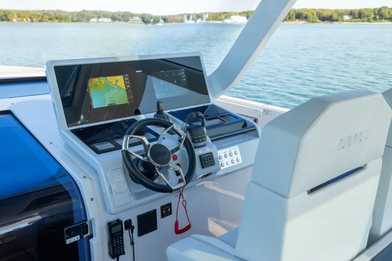 Slide: The Image of Helm of 2023 Fjord 41 XL yacht with navigation screens and steering wheel. - 31