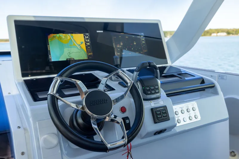 Slide: The Image of 2023 Fjord 41 XL yacht helm with advanced navigation system and controls. - 34
