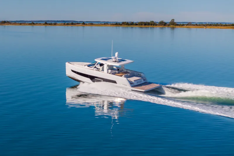 Slide: The Image of 2023 Fjord 41 XL yacht cruising on calm blue waters. - 62