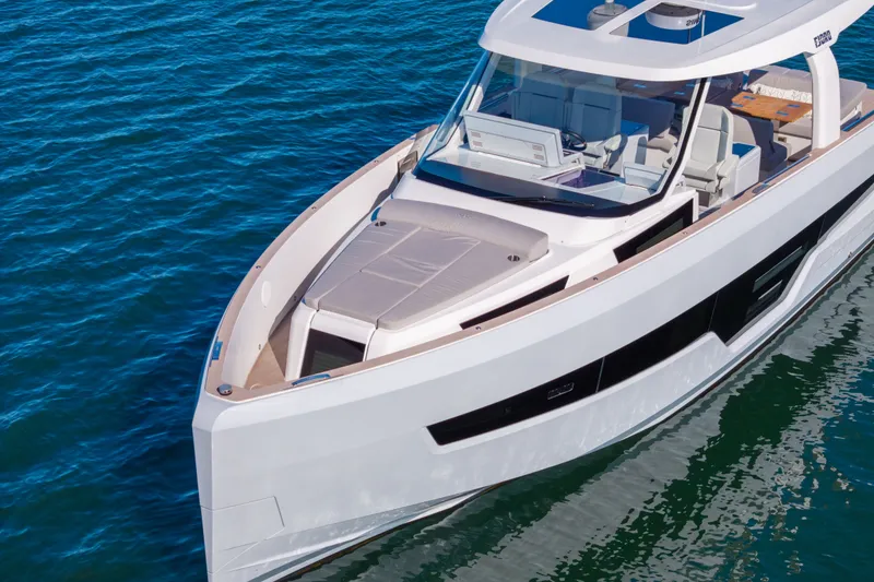 Slide: The Image of 2023 Fjord 41 XL luxury yacht cruising on blue water. - 11