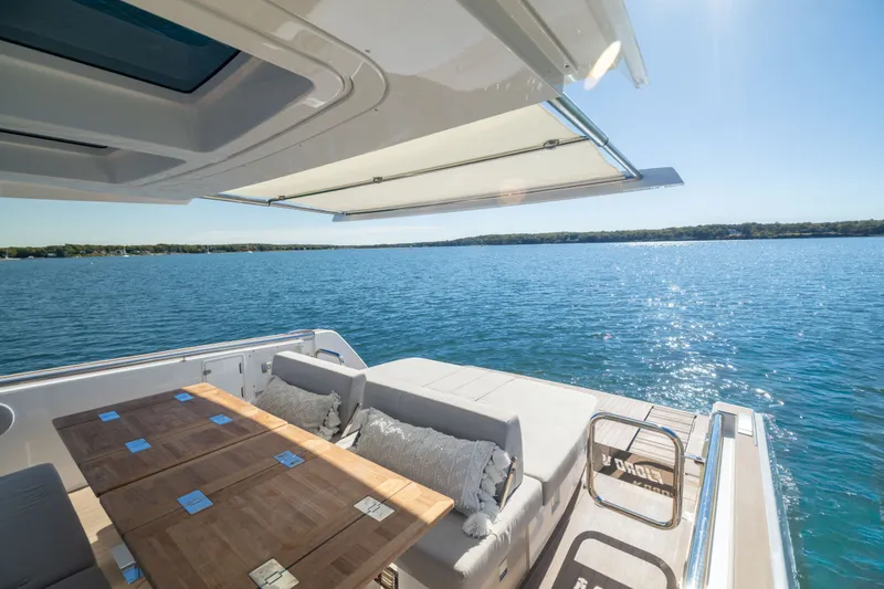 Slide: The Image of Luxurious 2023 Fjord 41 XL yacht with spacious deck and scenic ocean view. - 16