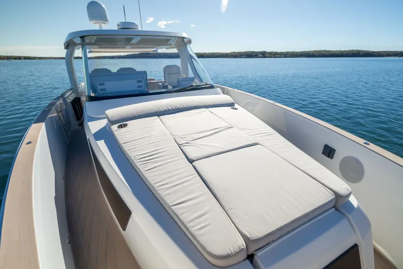 Slide: The Image of 2023 Fjord 41 XL luxury yacht with spacious sunbed on calm water. - 42