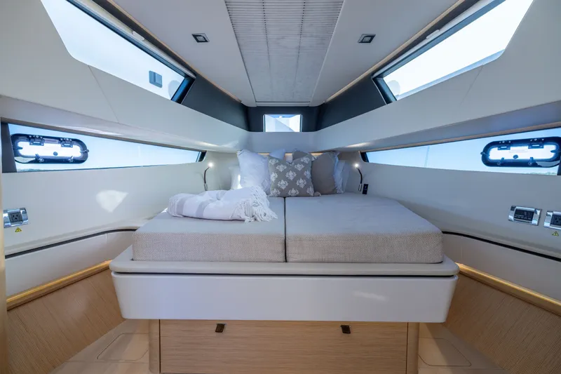 Slide: The Image of Luxurious cabin interior of 2023 Fjord 41 XL yacht with modern bedding and windows. - 54