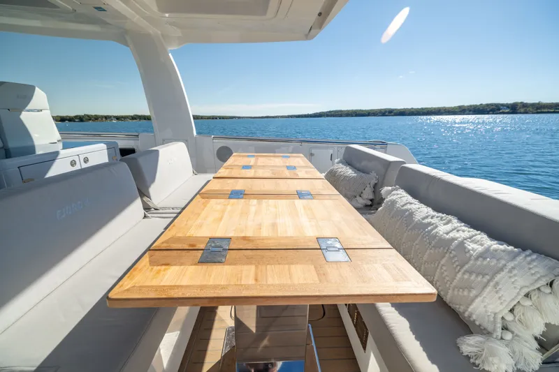 Slide: The Image of Luxurious 2023 Fjord 41 XL yacht interior with wooden table and comfortable seating. - 19