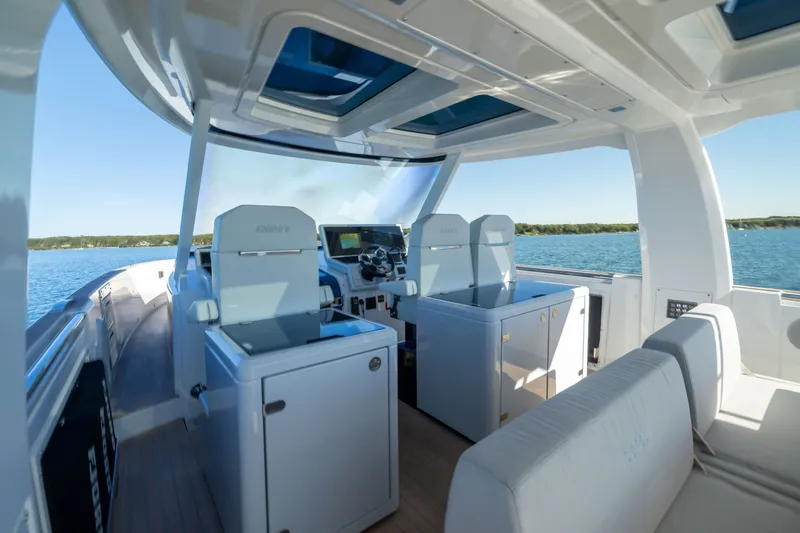 Slide: The Image of Interior view of 2023 Fjord 41 XL yacht with modern seating and steering console. - 24
