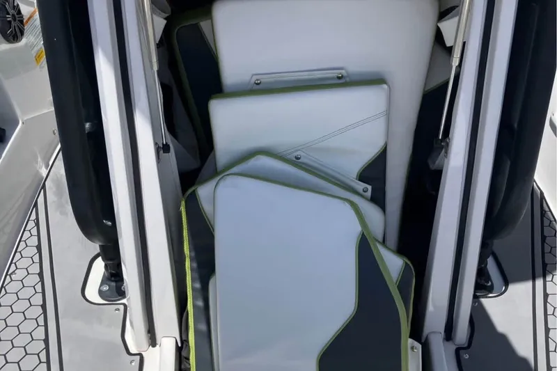 Slide: The Image of Interior view of 2017 Scarab 195 ID boat with white and green seating. - 14