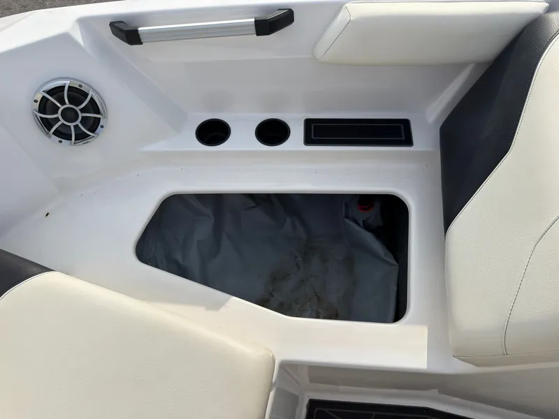 Slide: The Image of A white boat seat with black accents, speaker, and cup holders. - 41