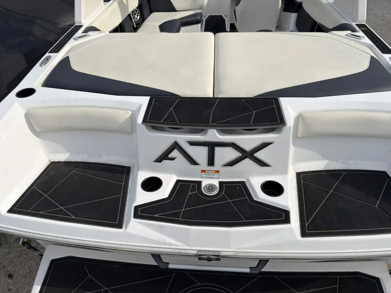 Slide: The Image of The image shows the rear of a 2020 ATX Surf Boats 22 Type-S with black and white upholstery. - 4