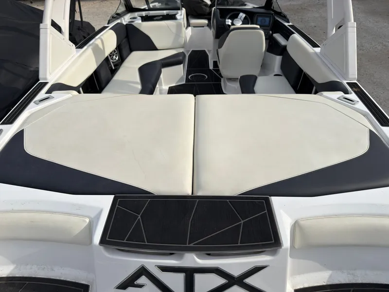 Slide: The Image of The image shows the interior of a 2020 ATX Surf Boats 22 Type-S with white and black seating. - 8