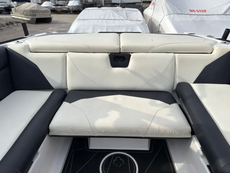 Slide: The Image of The image shows the rear seating of a 2020 ATX Surf Boats 22 Type-S with white and black upholstery. - 18