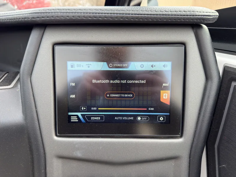 Slide: The Image of The image shows a boat dashboard with a touchscreen display indicating Bluetooth audio. - 32