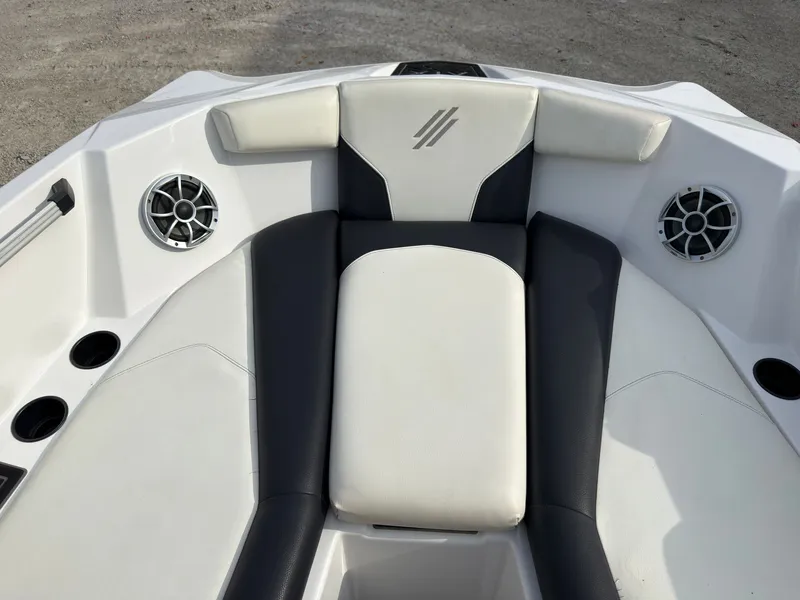 Slide: The Image of The image shows the bow of a 2020 ATX Surf Boats 22 Type-S with cushioned seats and speakers. - 38
