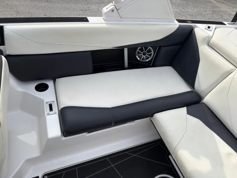 Slide: The Image of The image shows a modern boat seat with white and black upholstery and a speaker. - 16