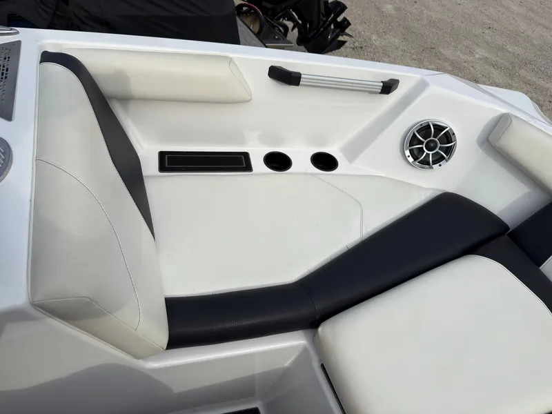 Slide: The Image of Seating area of a 2020 ATX Surf Boats 22 Type-S with speaker and cup holders. - 36