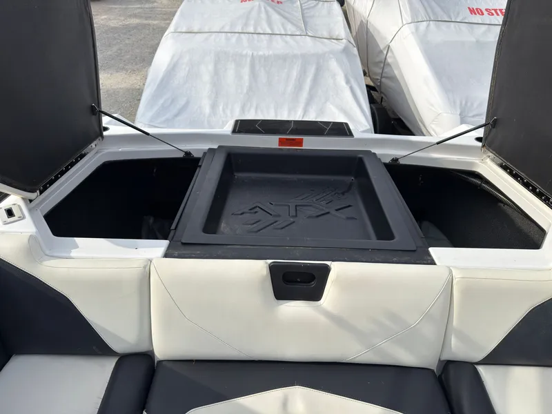 Slide: The Image of The image shows the storage area of a 2020 ATX Surf Boats 22 Type-S. - 10
