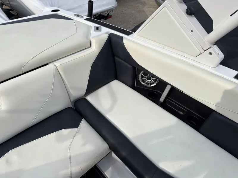 Slide: The Image of The 2020 ATX Surf Boats 22 Type-S features stylish seating with white and black upholstery. - 19