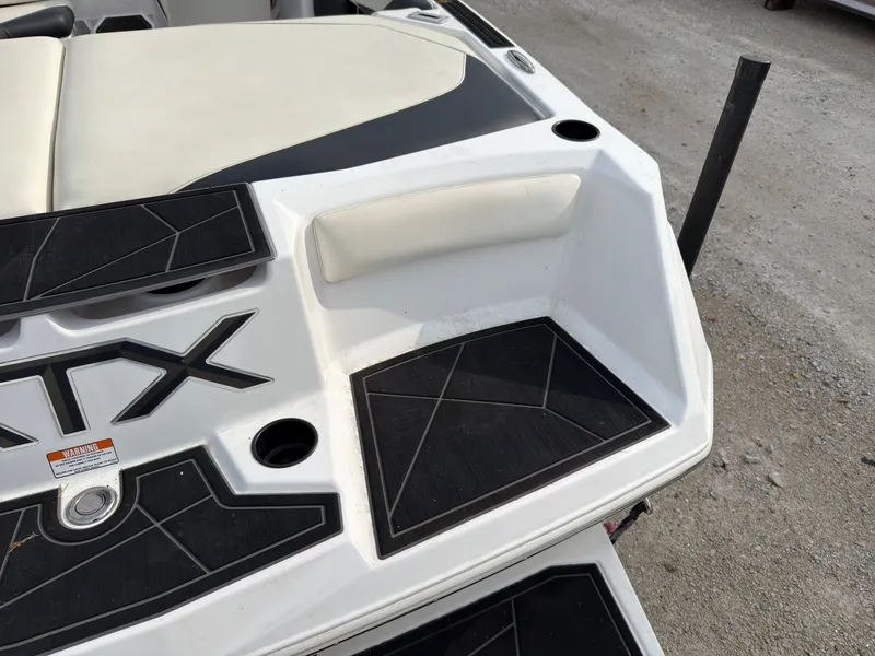 Slide: The Image of The image shows the rear of an ATX Surf Boat with black and white details. - 7