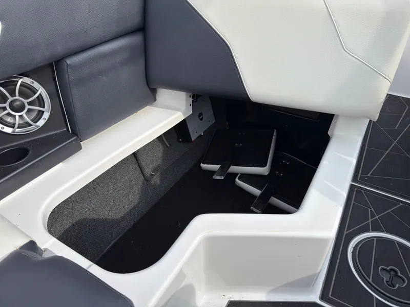 Slide: The Image of Interior of a 2020 ATX Surf Boats 22 Type-S with pedals and speaker. - 23