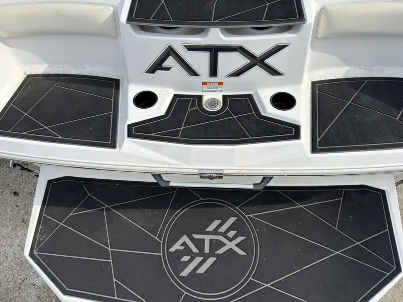 Slide: The Image of Rear deck of an ATX Surf Boat with non-slip mats and cup holders. - 3