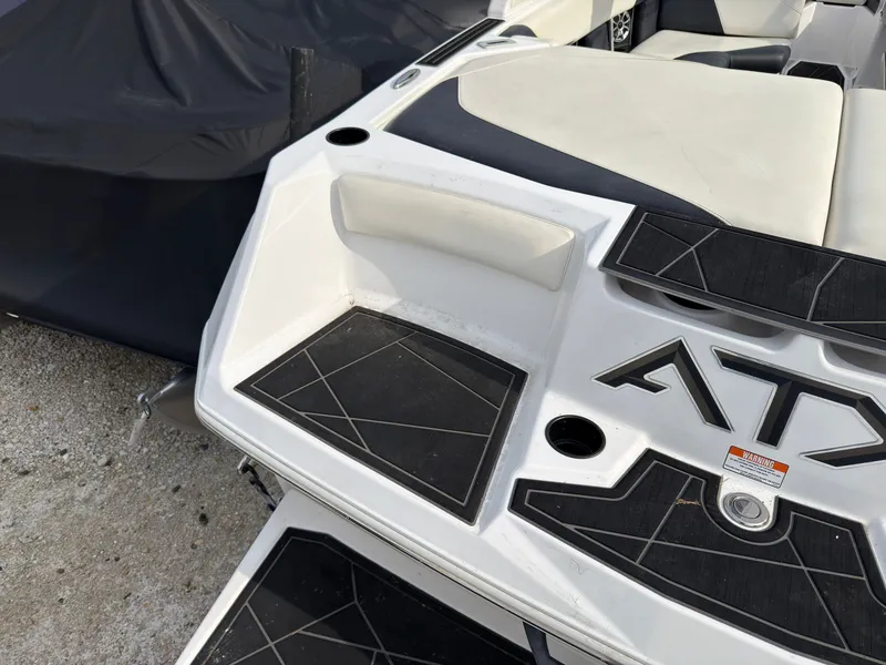 Slide: The Image of The image shows the rear of a 2020 ATX Surf Boats 22 Type-S with black and white details. - 5