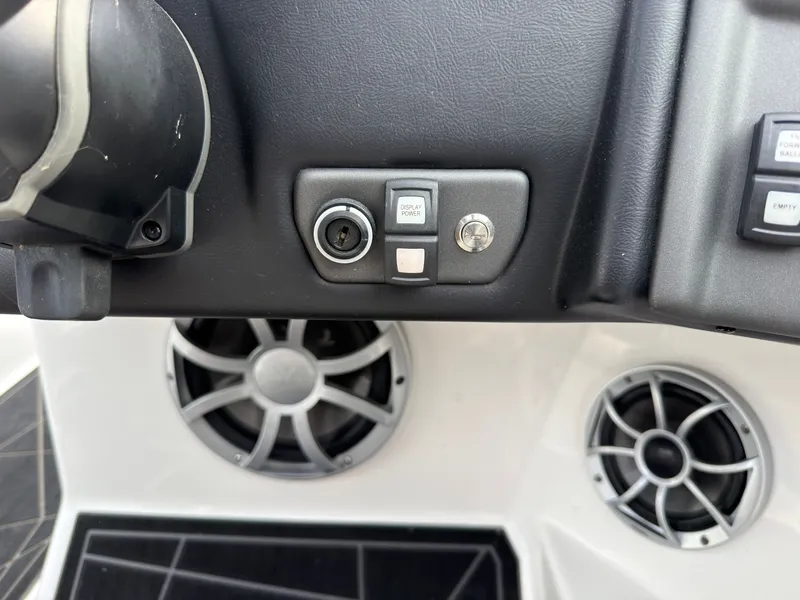 Slide: The Image of Close-up of the dashboard of a 2020 ATX Surf Boats 22 Type-S with speakers. - 29