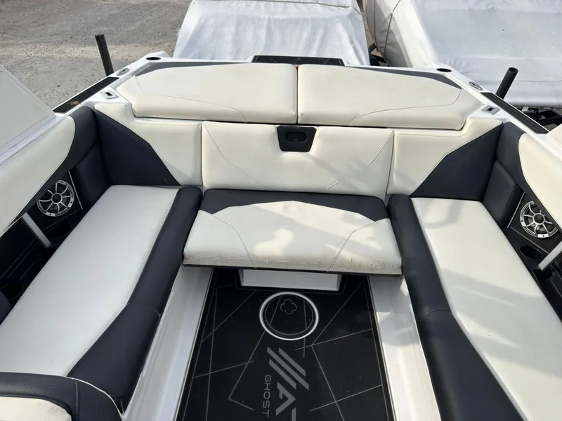 Slide: The Image of The image shows the cockpit of a 2020 ATX Surf Boats 22 Type-S with white and black seating. - 15
