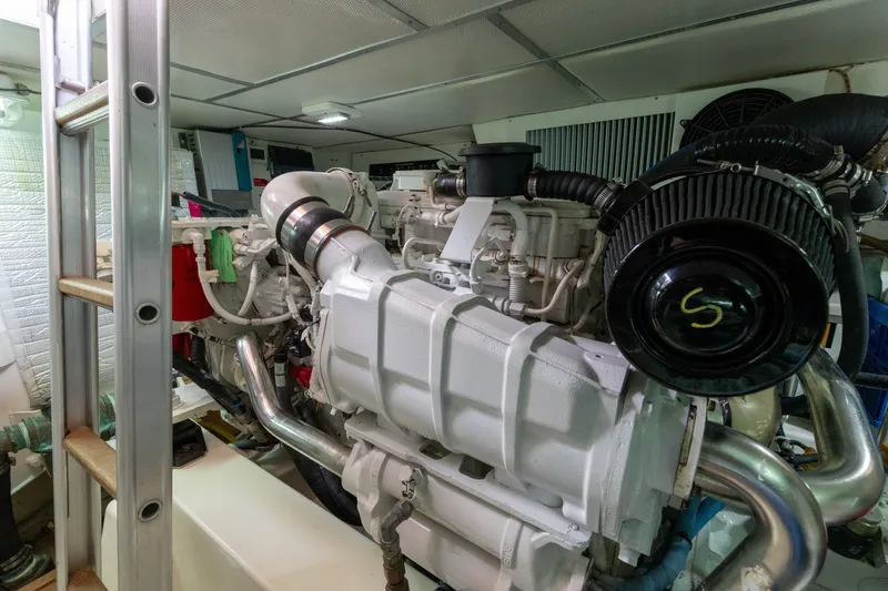 Slide: The Image of Engine room of 2009 Grand Banks 45 Eastbay SX yacht, showcasing machinery and components. - 79