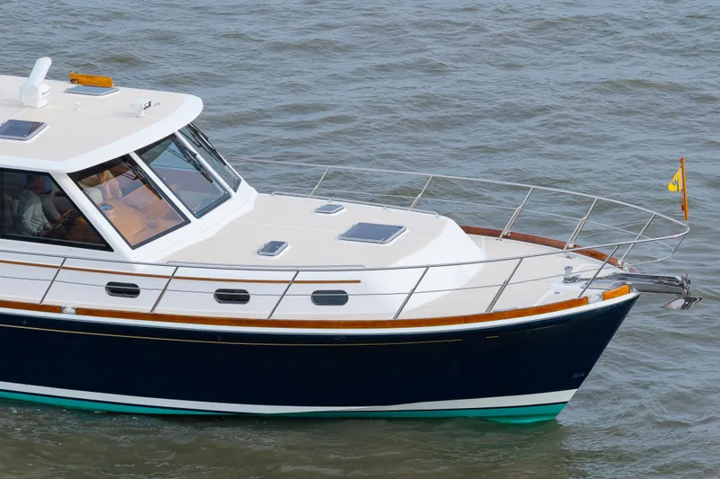 Slide: The Image of 2009 Grand Banks 45 Eastbay SX yacht cruising on open water. - 97