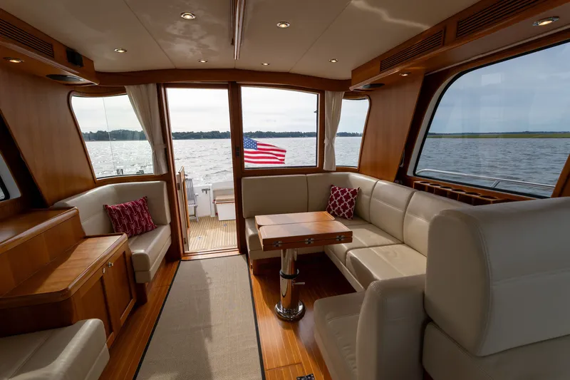 Slide: The Image of Luxurious interior of 2009 Grand Banks 45 Eastbay SX yacht with elegant seating and scenic water view. - 24