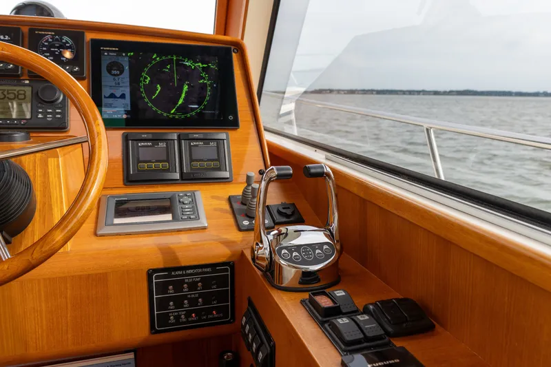 Slide: The Image of 2009 Grand Banks 45 Eastbay SX helm with navigation instruments and sea view. - 32