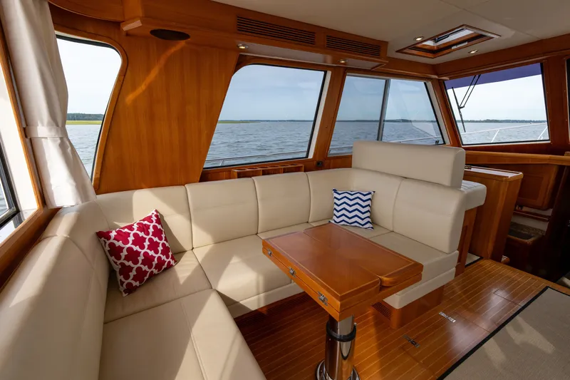 Slide: The Image of Luxurious interior of 2009 Grand Banks 45 Eastbay SX yacht with elegant seating and scenic view. - 18