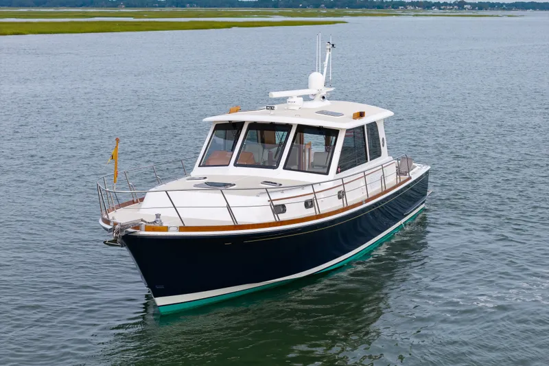 Slide: The Image of 2009 Grand Banks 45 Eastbay SX yacht cruising on calm waters. - 86