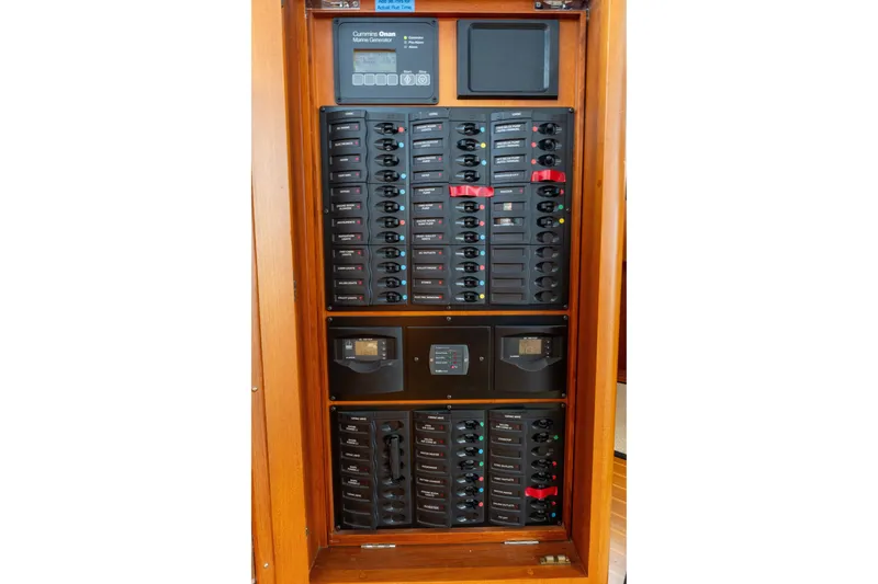 Slide: The Image of Electrical panel of 2009 Grand Banks 45 Eastbay SX yacht, featuring circuit breakers and controls. - 47