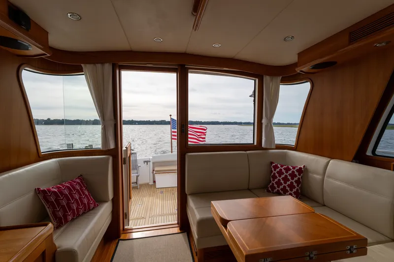 Slide: The Image of Interior of 2009 Grand Banks 45 Eastbay SX yacht with lake view and American flag. - 22