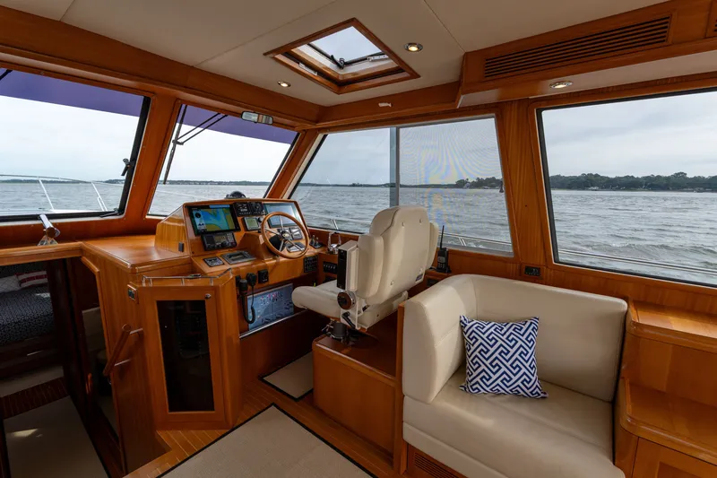Slide: The Image of Interior of 2009 Grand Banks 45 Eastbay SX yacht with helm and seating area. - 16