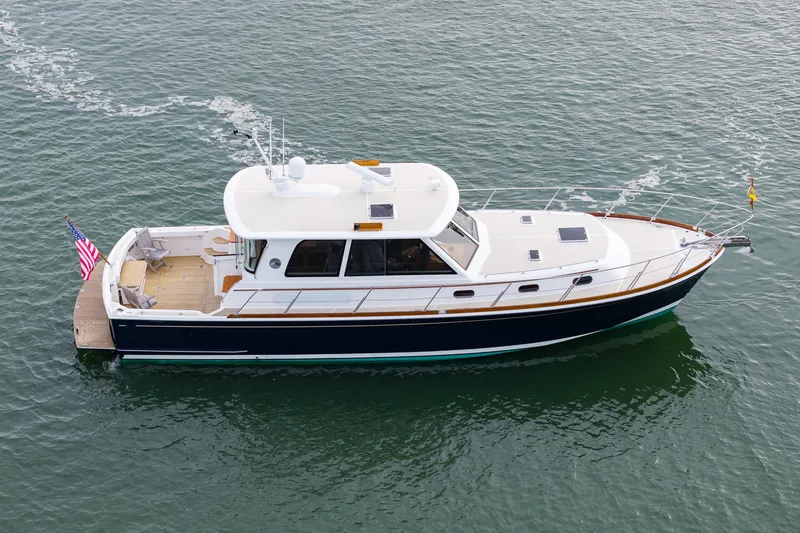 Slide: The Image of 2009 Grand Banks 45 Eastbay SX yacht cruising on calm waters. - 85